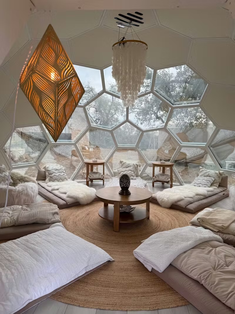 Honeycomb dome interior with cushions and natural light