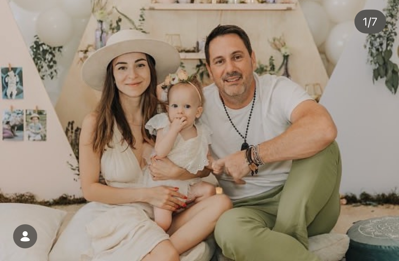 William with his wife and child